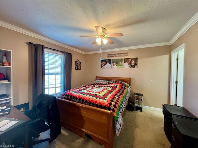 carpeted bedroom with crown molding and ceiling fan