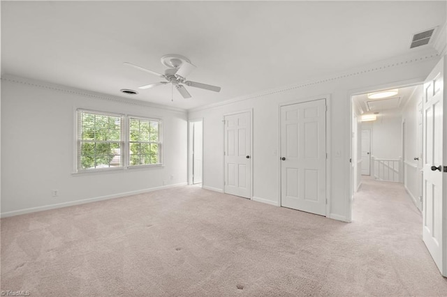 3408 Deep Green Dr, Greensboro, NC 27410 - unfurnished bedroom with attic access, light colored carpet, two closets, baseboards, and crown molding