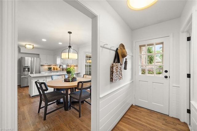 3408 Deep Green Dr, Greensboro, NC 27410 - entryway with a sink, wood finished floors, a wainscoted wall, and recessed lighting