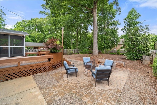3408 Deep Green Dr, Greensboro, NC 27410 - view of patio with a deck, fence, a fire pit, and a sunroom