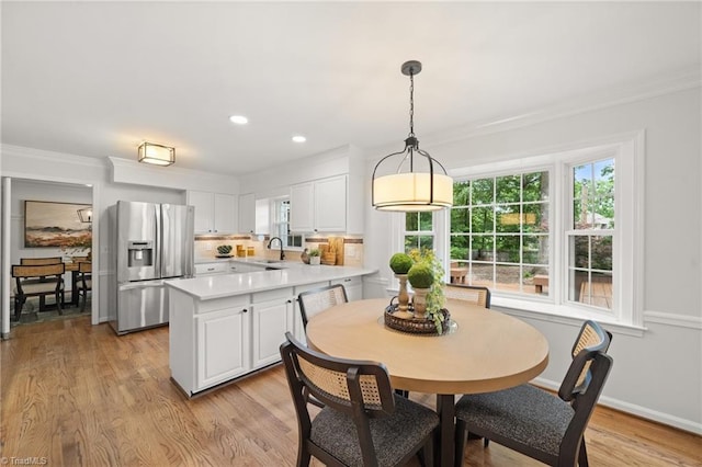 3408 Deep Green Dr, Greensboro, NC 27410 - dining area with crown molding, light wood-style floors, recessed lighting, and baseboards