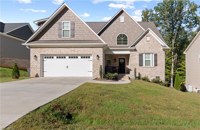 craftsman-style house featuring a front yard and a garage