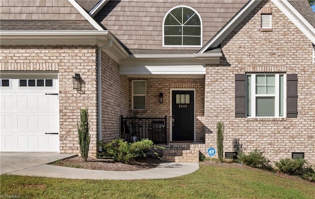 property entrance with a porch and a garage