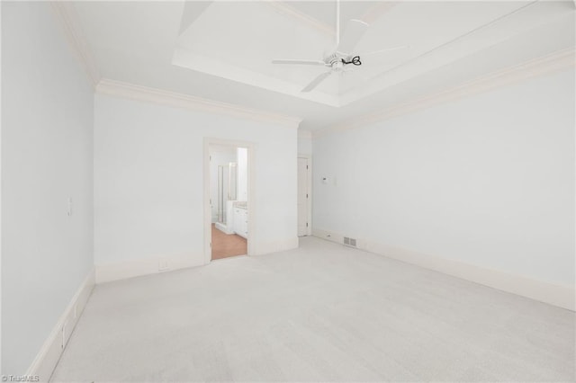 1000 Brookmeade Dr, Winston-Salem, NC 27106 - spare room featuring crown molding, light colored carpet, a tray ceiling, and a ceiling fan