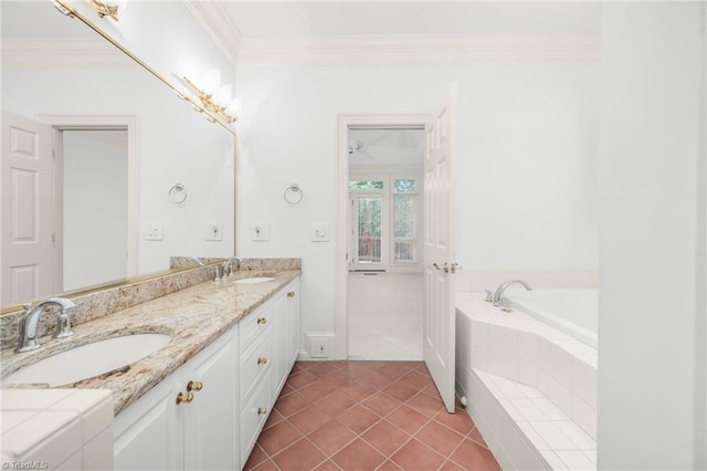 1000 Brookmeade Dr, Winston-Salem, NC 27106 - full bathroom featuring double vanity, a bath, crown molding, tile patterned flooring, and washer / clothes dryer