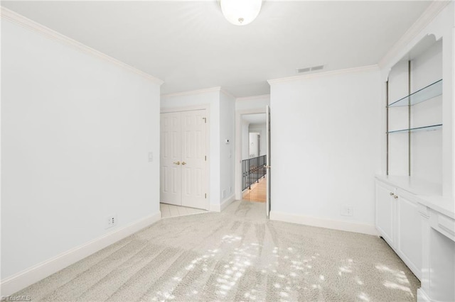 1000 Brookmeade Dr, Winston-Salem, NC 27106 - unfurnished bedroom featuring ornamental molding, a closet, and carpet floors