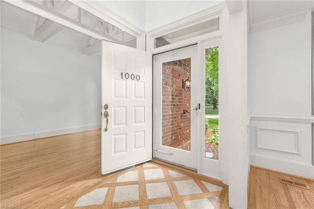 1000 Brookmeade Dr, Winston-Salem, NC 27106 - foyer entrance with wood finished floors and crown molding