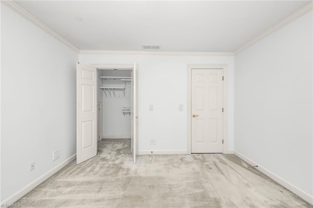 1000 Brookmeade Dr, Winston-Salem, NC 27106 - unfurnished bedroom featuring ornamental molding, carpet floors, a walk in closet, and a closet