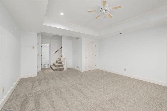 1000 Brookmeade Dr, Winston-Salem, NC 27106 - spare room featuring a raised ceiling, stairs, carpet flooring, a ceiling fan, and crown molding