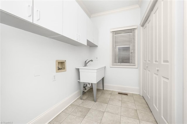 1000 Brookmeade Dr, Winston-Salem, NC 27106 - washroom with cabinet space, ornamental molding, washer hookup, and light tile patterned flooring