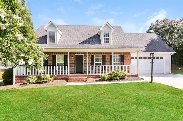 new england style home featuring a porch, a garage, and a front lawn