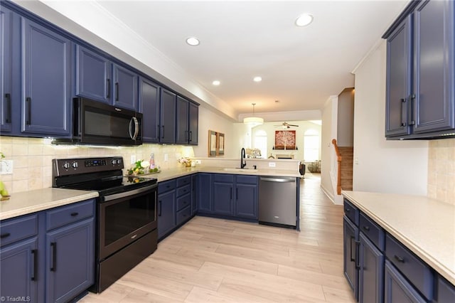 4294 Plantation Ridge Ln, Greensboro, NC 27409 - kitchen featuring black appliances, a peninsula, ceiling fan, blue cabinets, and ornamental molding
