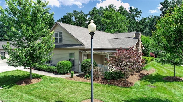 4294 Plantation Ridge Ln, Greensboro, NC 27409 - view of front of home featuring a front lawn and roof with shingles