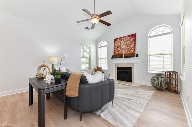 4294 Plantation Ridge Ln, Greensboro, NC 27409 - living room featuring vaulted ceiling, healthy amount of natural light, light wood-style flooring, and ceiling fan