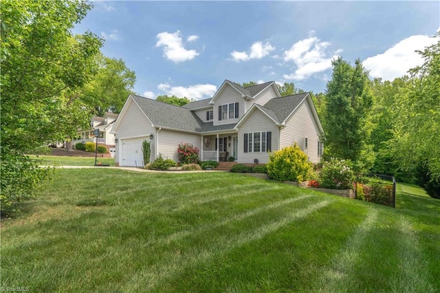 view of front of property featuring an attached garage, a shingled roof, and a front yard