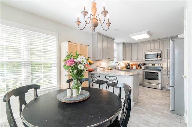 dining area featuring a notable chandelier