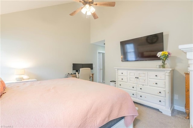 bedroom featuring light colored carpet, ceiling fan, and high vaulted ceiling
