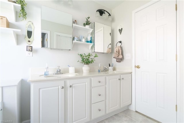 bathroom featuring a sink, tile patterned flooring, and double vanity