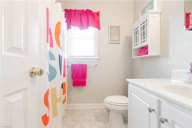 bathroom with tile patterned flooring, vanity, toilet, baseboards, and a shower with curtain