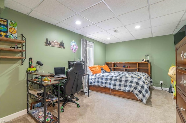 carpeted bedroom featuring baseboards, recessed lighting, a paneled ceiling, and visible vents