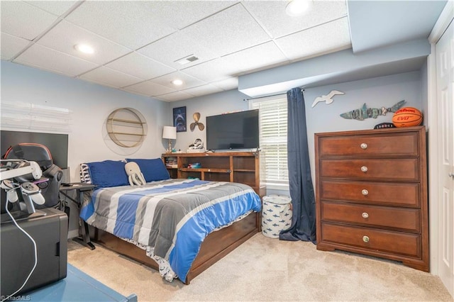 carpeted bedroom with visible vents, recessed lighting, and a drop ceiling