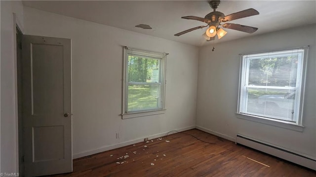 2806 Robin Hood Dr, Greensboro, NC 27408 - unfurnished room with a baseboard radiator, baseboards, a ceiling fan, and wood finished floors
