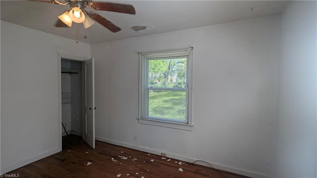2806 Robin Hood Dr, Greensboro, NC 27408 - unfurnished bedroom with baseboards, a ceiling fan, and wood finished floors