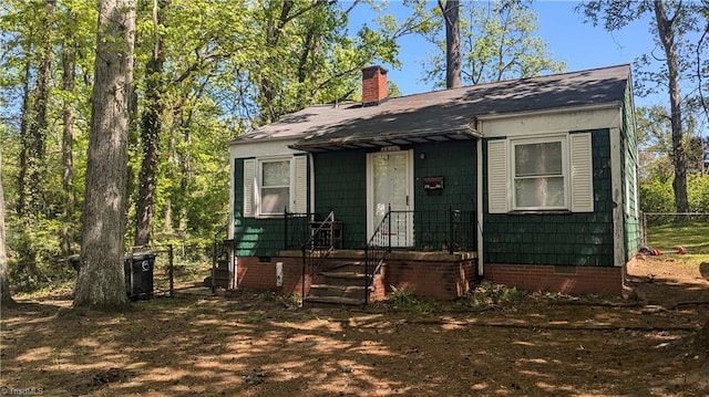 2806 Robin Hood Dr, Greensboro, NC 27408 - view of front of house featuring fence, crawl space, and a chimney