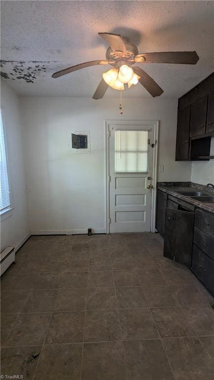 2806 Robin Hood Dr, Greensboro, NC 27408 - interior space featuring a baseboard radiator, a sink, a textured ceiling, and ceiling fan