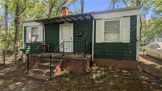 2806 Robin Hood Dr, Greensboro, NC 27408 - view of front of home featuring a chimney and crawl space