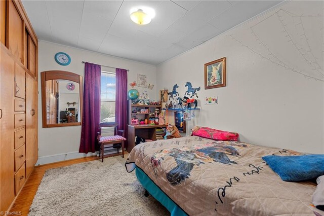 bedroom featuring light wood-type flooring