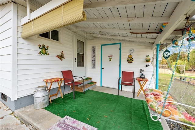 doorway to property with a yard