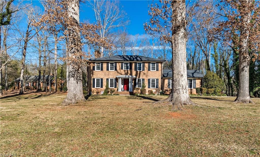 colonial home with a front yard