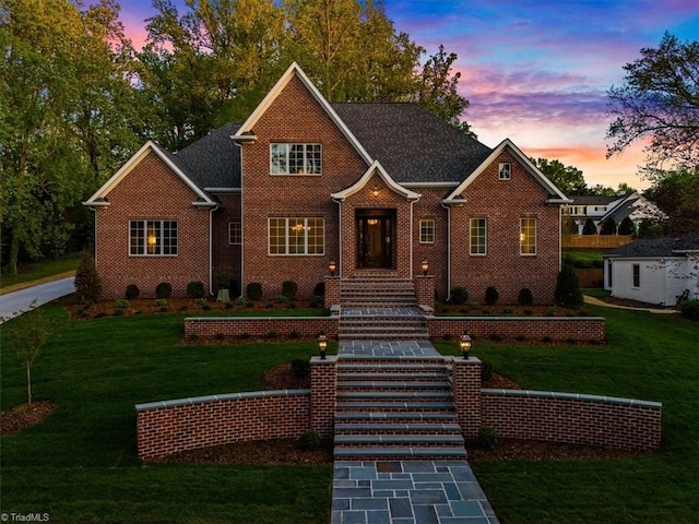 905 Brookside Dr, Greensboro, NC 27408 - view of front of house featuring brick siding and a yard