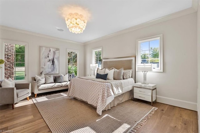 905 Brookside Dr, Greensboro, NC 27408 - bedroom featuring multiple windows, baseboards, and ornamental molding