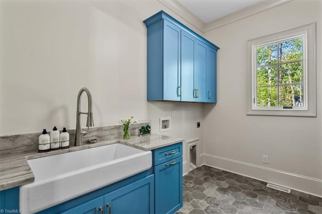 905 Brookside Dr, Greensboro, NC 27408 - washroom featuring a sink, visible vents, washer hookup, cabinet space, and electric dryer hookup