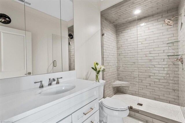 905 Brookside Dr, Greensboro, NC 27408 - full bath featuring a shower stall, visible vents, toilet, and vanity