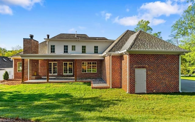 905 Brookside Dr, Greensboro, NC 27408 - rear view of property featuring a chimney, a yard, a patio, and french doors