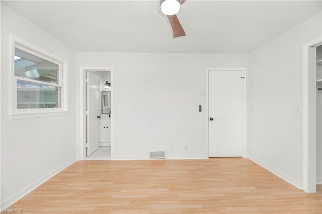 spare room with light hardwood / wood-style floors and ceiling fan