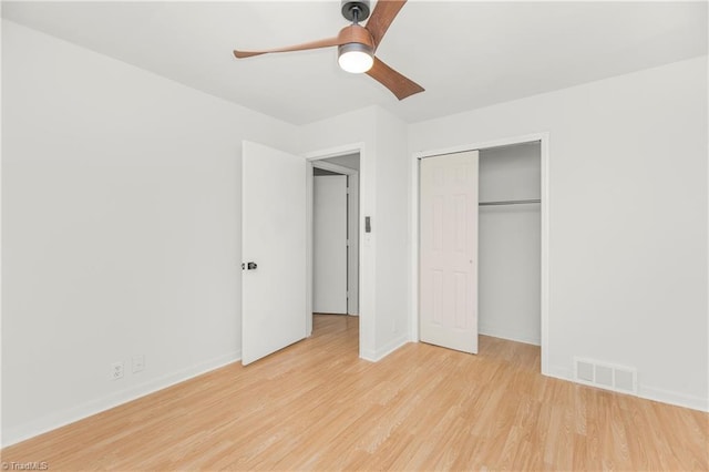 unfurnished bedroom featuring ceiling fan, a closet, and light hardwood / wood-style floors