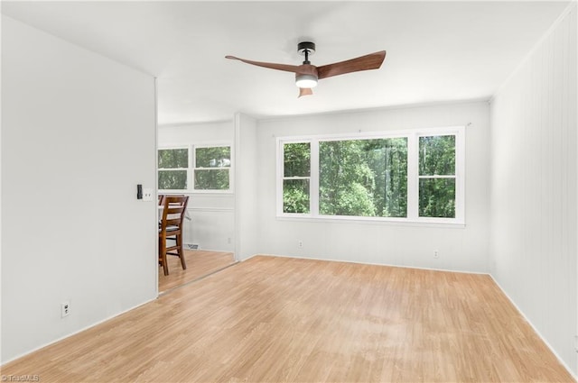 spare room featuring light wood-type flooring and ceiling fan