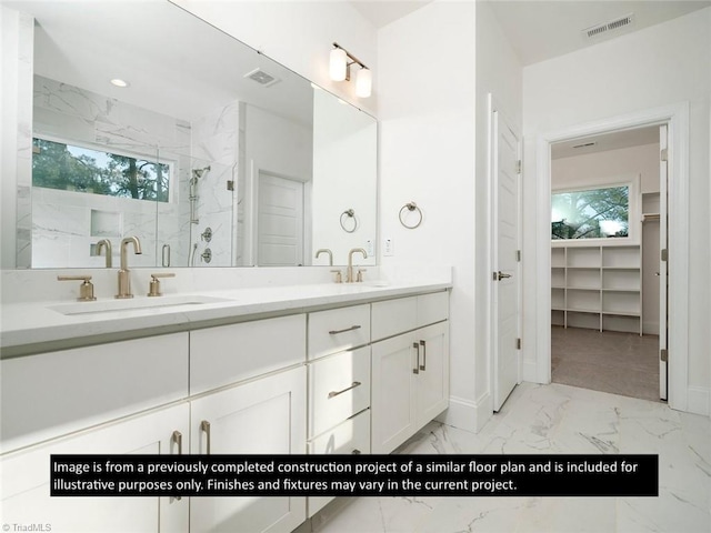 bathroom featuring vanity and walk in shower