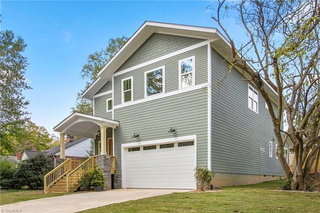 view of front of property featuring a front lawn and a garage