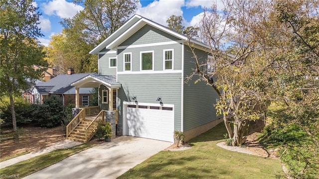 view of front of home featuring a front yard and a garage