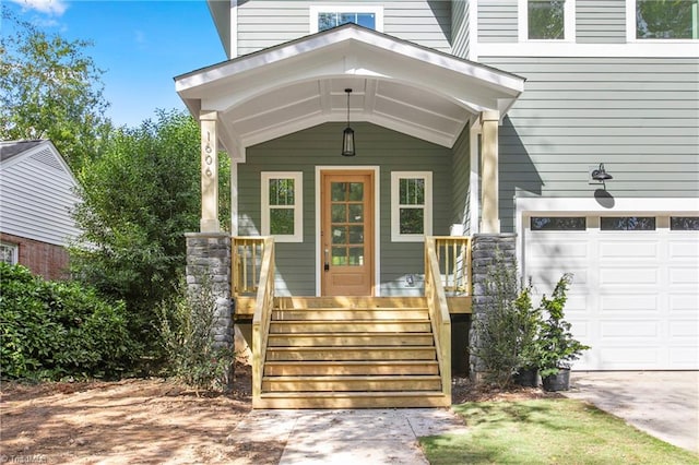 property entrance with a garage and covered porch