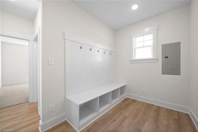 mudroom with electric panel, baseboards, wood finished floors, and recessed lighting