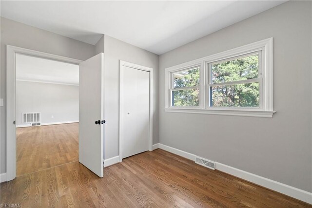 unfurnished bedroom featuring light hardwood / wood-style floors