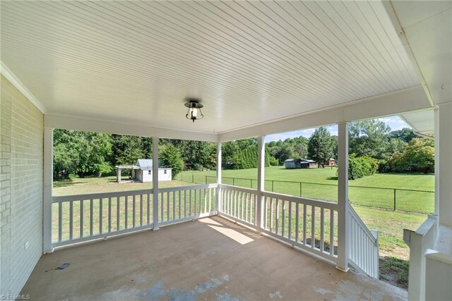 view of patio / terrace with a storage shed