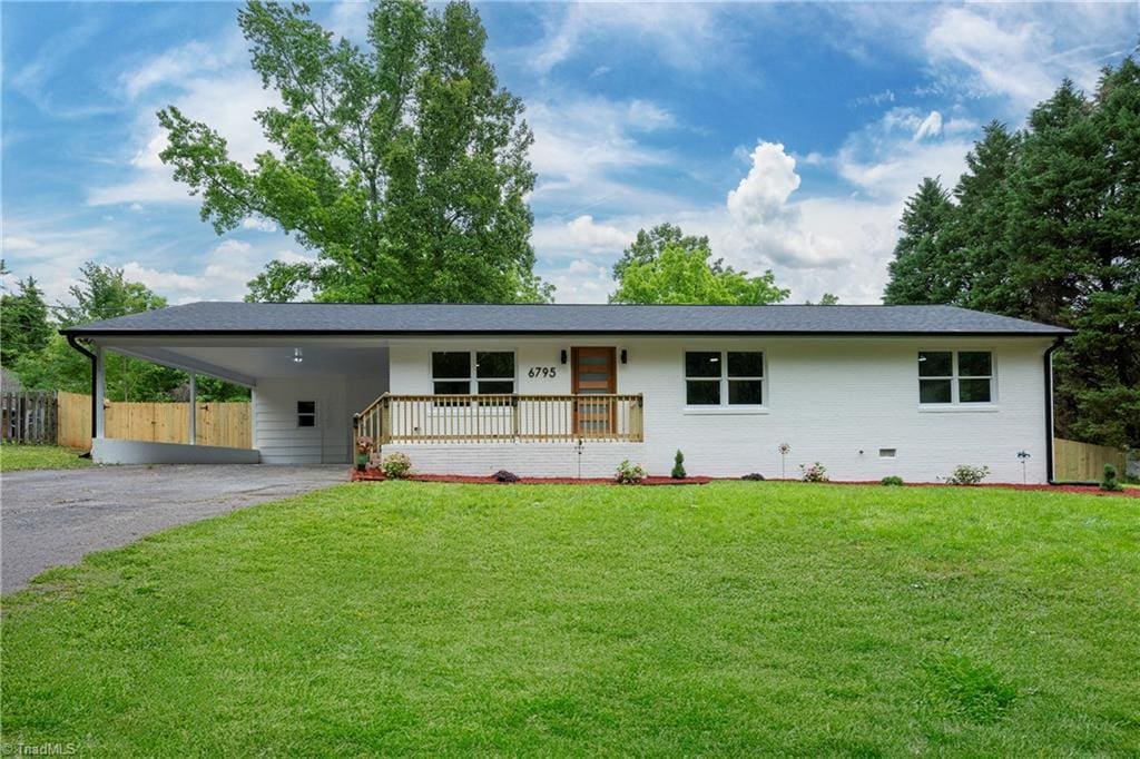 6795 Vance Rd, Kernersville, NC 27284 - single story home with asphalt driveway, a carport, and covered porch