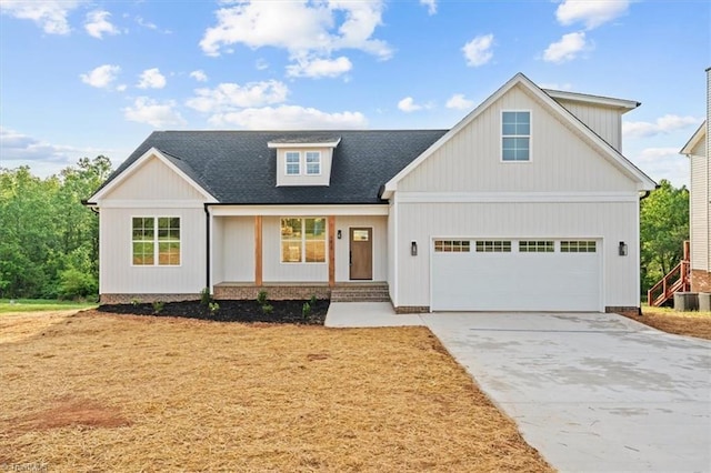 modern farmhouse style home with concrete driveway, an attached garage, and a shingled roof